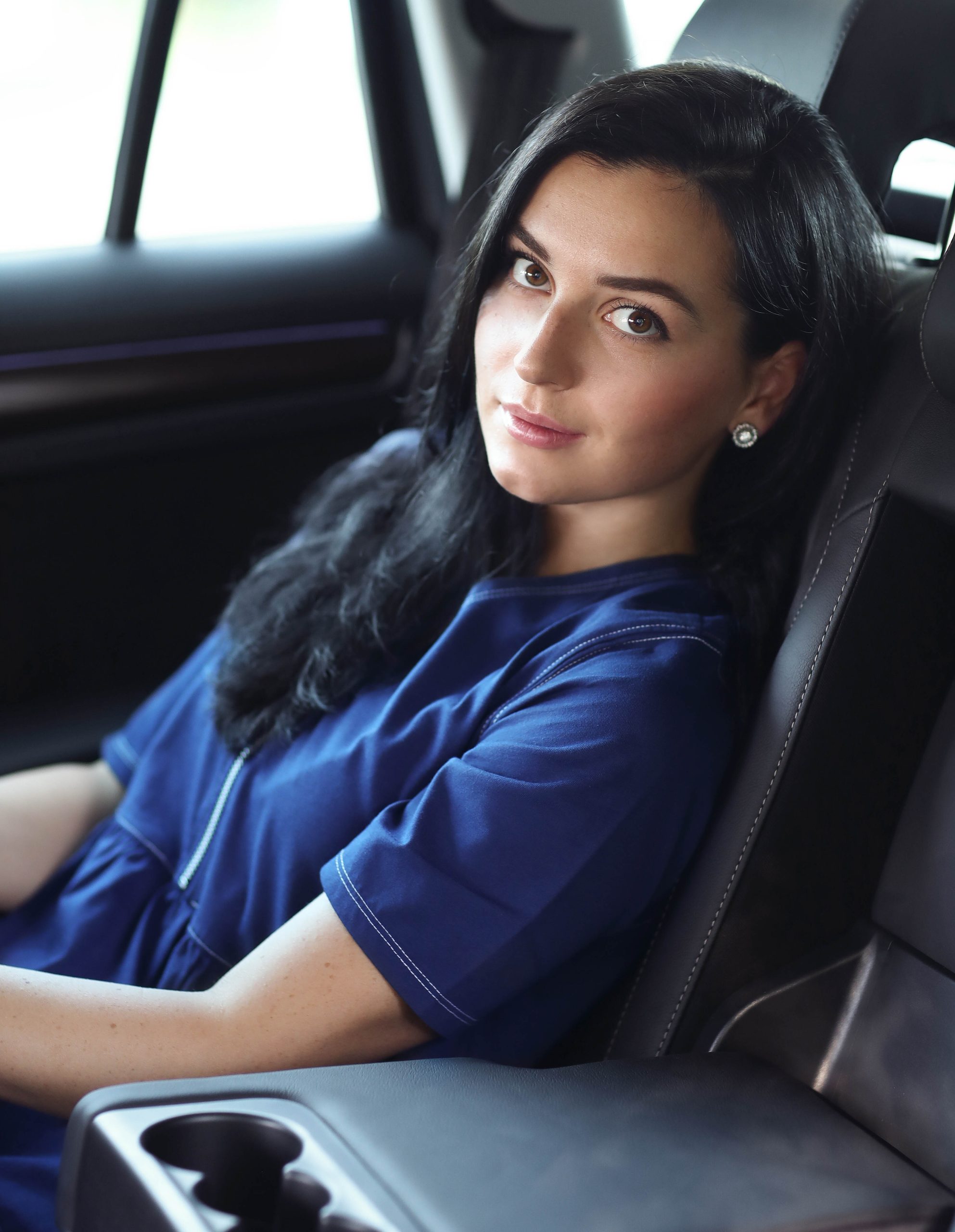 Businesswoman in car as a passanger